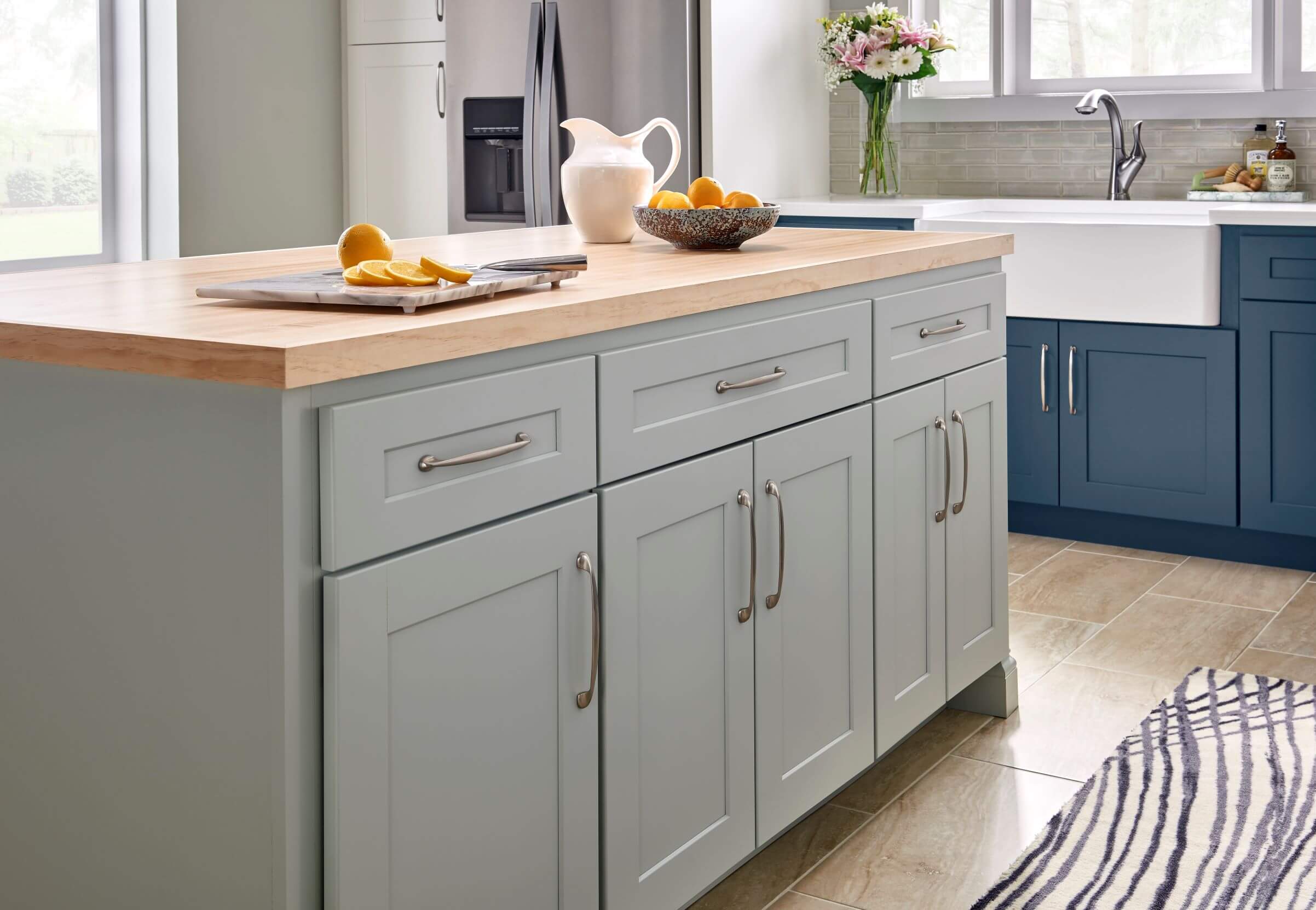 East Coast Prebuilt Kitchen Cabinets with gray island and butcher block countertop